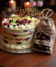 Fresh fruit cake with premium dry fruit chocolates – gift delivery in Ahmedabad