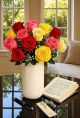 mixed roses arranged in white ceramic vase- Ahmedabad