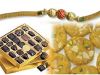 Sweets and gold plated rakhi.